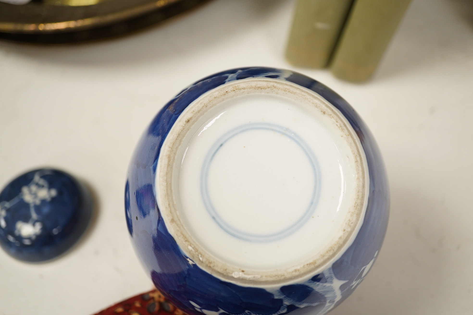 A group of Chinese blue and white porcelain, including a mid 19th century Canton enamel teabowl and a Japanese small dish, tallest 22cm. Condition - fair